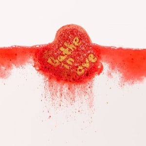 Sparkling bath bomb in the shape of a heart